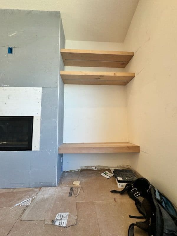 Custom Living Room Transformation with Fireplace and LED Shelves